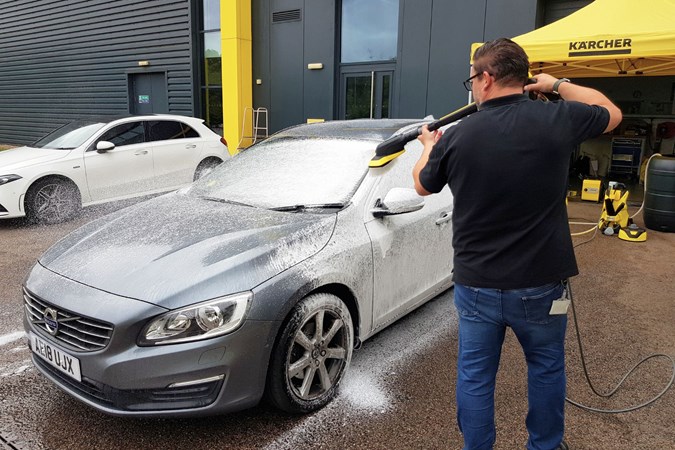 Martin Coles, Karcher's Product Training Manager, testing a pressure washer on Volvo.