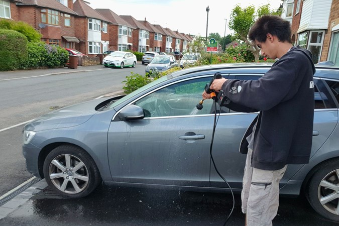 Aaron Hussain rinsing a Volvo V60 with a Jet Hawk Pressure Washer