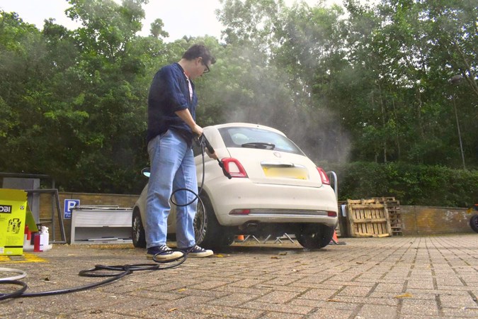 Ryan Gilmore cleaning a Fiat 500 with a Ryobi RY100PWA