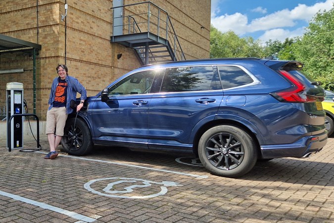 Honda CR-V e:PHEV long-term test on Parkers, side, with cj hubbard, plugged in to charge