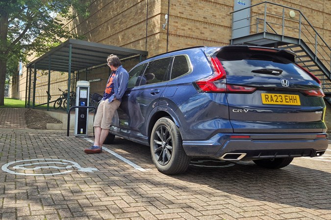 Honda CR-V e:PHEV long-term test on Parkers, rear, with cj hubbard, plugged in to charge