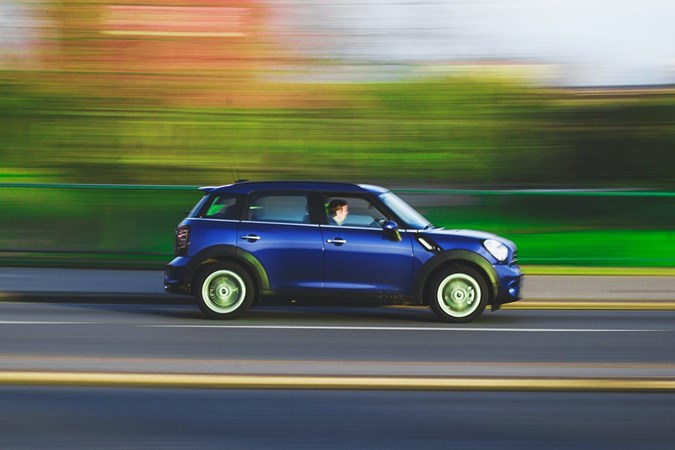 Mini Countryman driving on a road