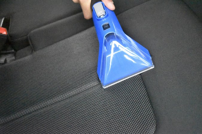 A close up of the Vax SpotWash Home Duo cleaning a car seat