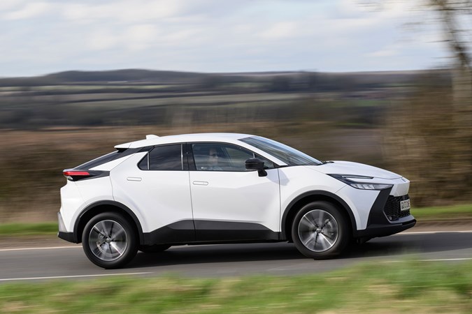 Toyota C-HR long-term review: side view driving, white paint