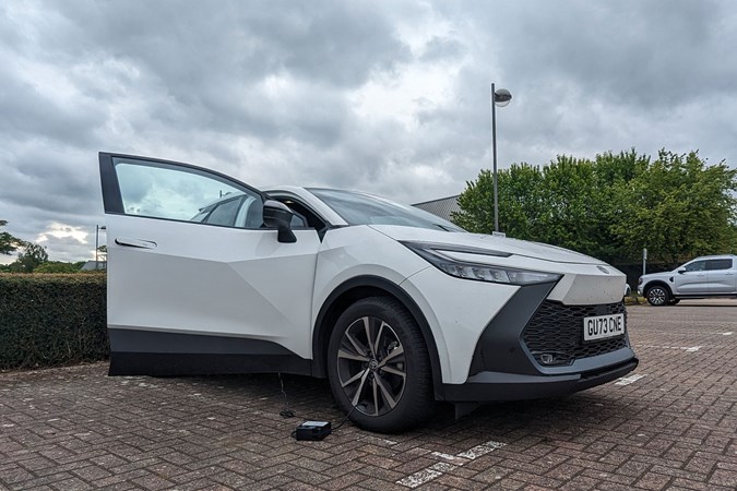 Toyota C-HR long-term review: front three quarter static, connected to a tyre inflator, white paint