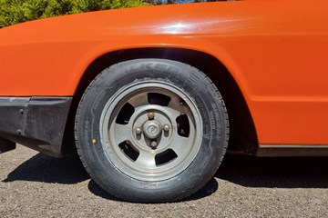 A picture of the Falken Sincera sidewalls applied to an orange car