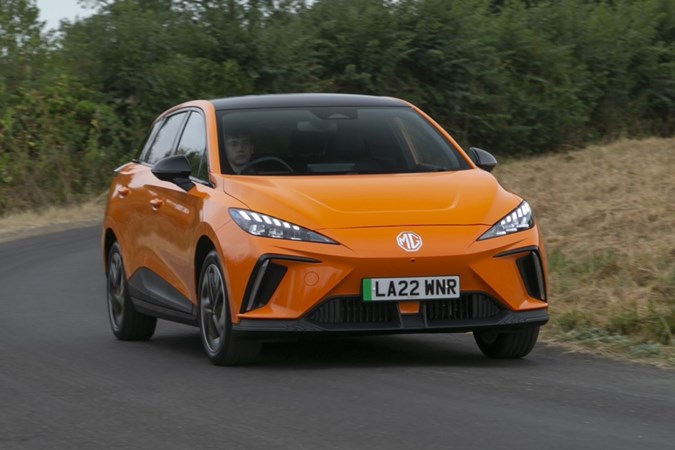 The future of fuel: MG 4 EV, front three quarter cornering, orange paint, British country road