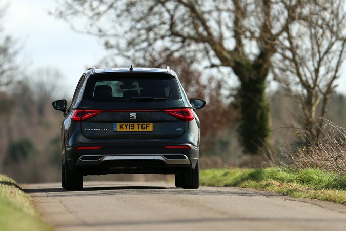 SEAT Tarraco review, dead-on rear, driving down single lane road 