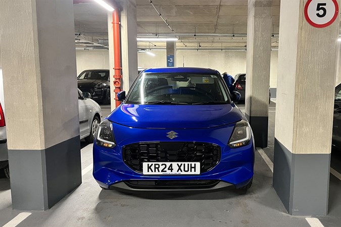 The Suzuki Swift fits perfectly into the tight parking spot. 