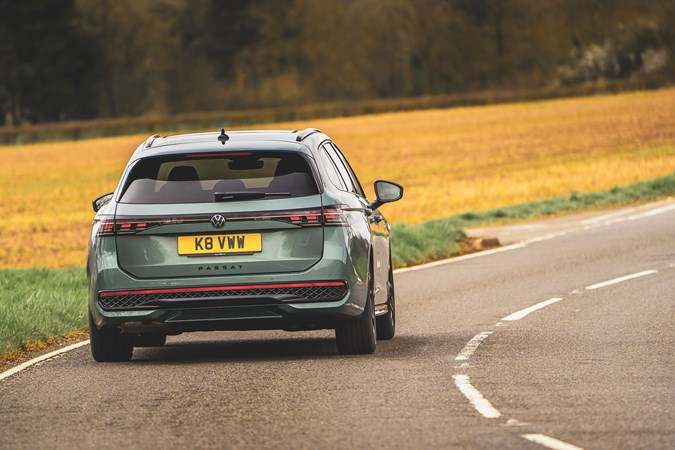 Volkswagen Passat review: rear three quarter driving, petrol green paint