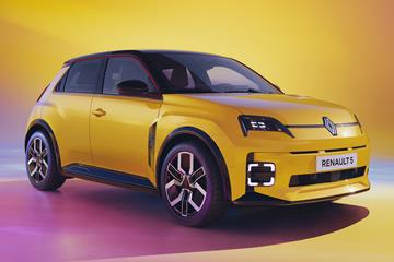 Renault 5 E-Tech Electric: front three quarter static, yellow paint, studio shoot