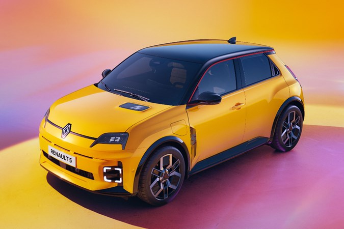 Renault 5 E-Tech Electric (2025): front three quarter static, high angle, yellow paint, studio shoot