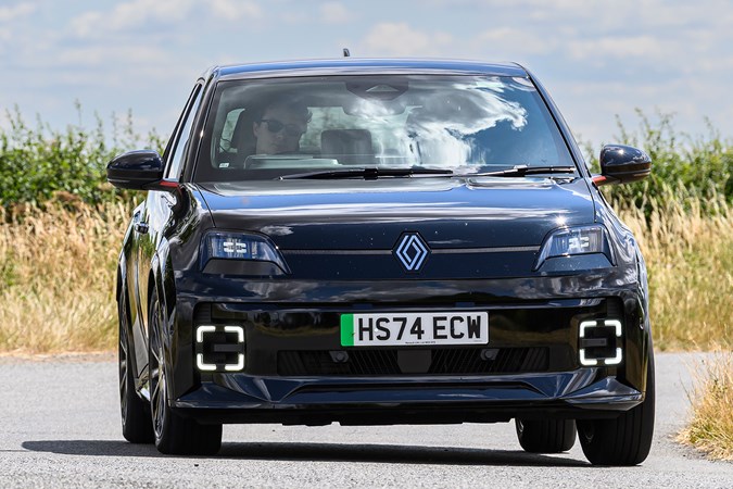 Renault 5 E-Tech long term test, black, head-on, cornering | Parkers