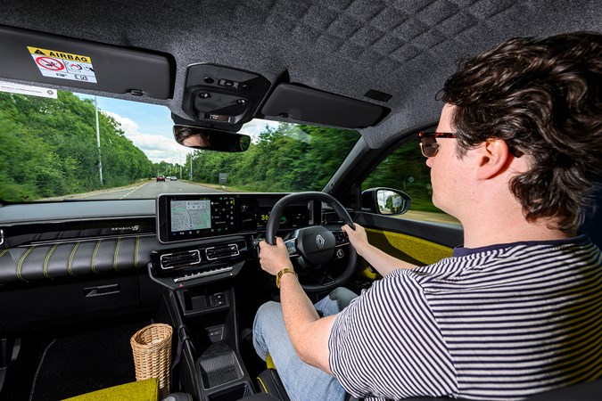 Ryan Gilmore drives the Renault 5 E-Tech, yellow and grey interior