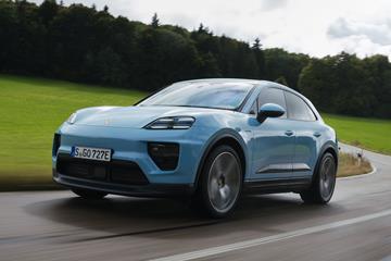 Porsche Macan (2024) review: front three quarter driving, blue paint