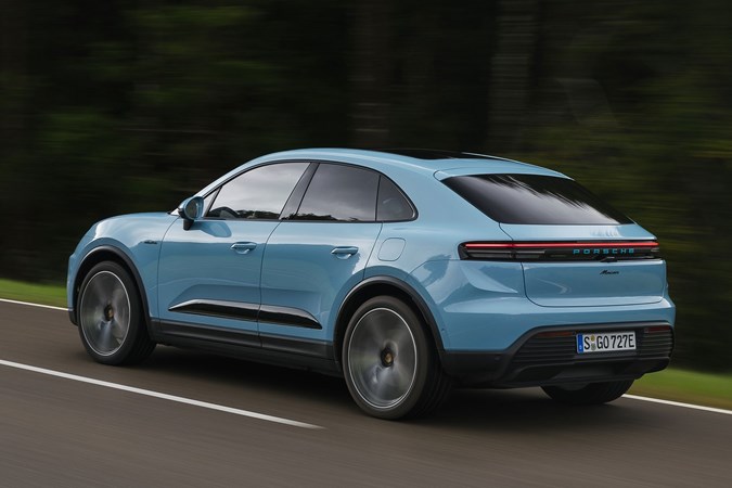 Porsche Macan Electric (2024) review: rear three quarter driving, blue paint, low angle