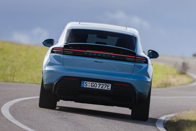 Porsche Macan Electric (2024) review: rear cornering, blue paint, low angle