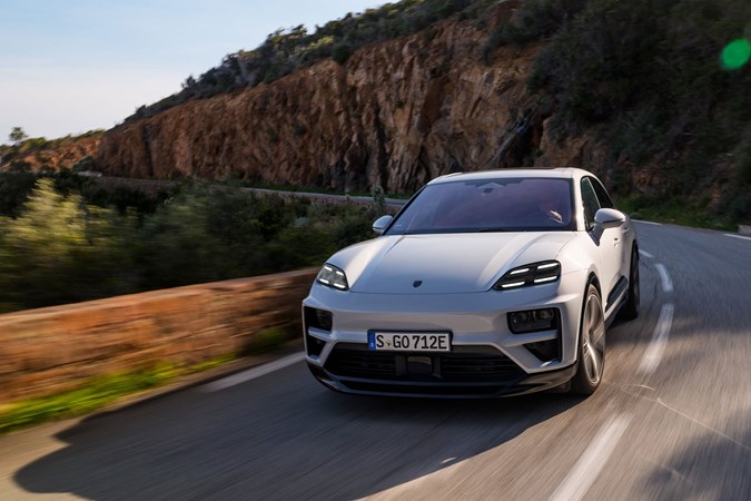Porsche Macan (2024) review: front three quarter cornering, mountain road, silver paint