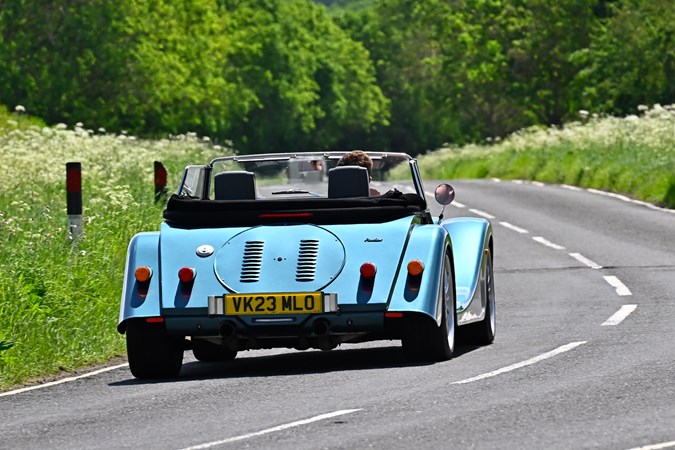 Morgan Plus Six review - rear, blue, driving in British sunshine, exclusive Bauer image