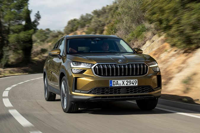 Skoda Kodiaq (2024) review: front three quarter driving, gold paint, country road