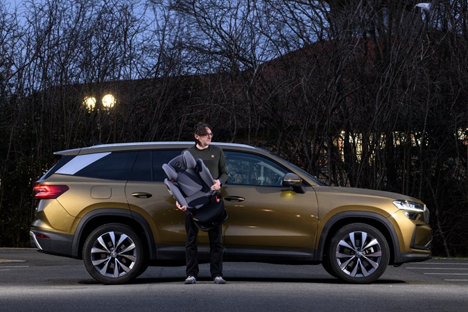 Skoda Kodiaq 2025 long-term test - side view, dark, with cj hubbard holding child seat