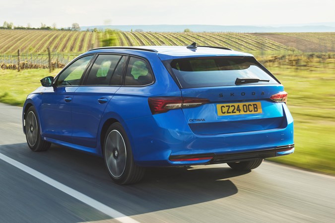 Blue Skoda Octavia Estate, rear, driving