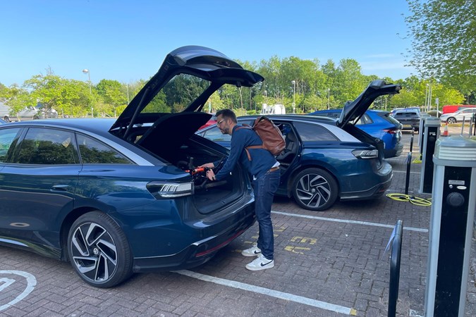 Loading the boot of the VW ID.7 hatchback with the Tourer in the background.