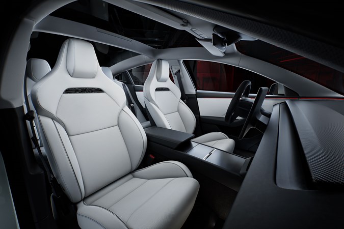 Tesla Model 3 Performance: front seats, white upholstery, studio shoot
