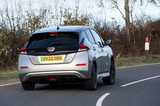 Nissan Leaf review - rear, driving round corner, silver