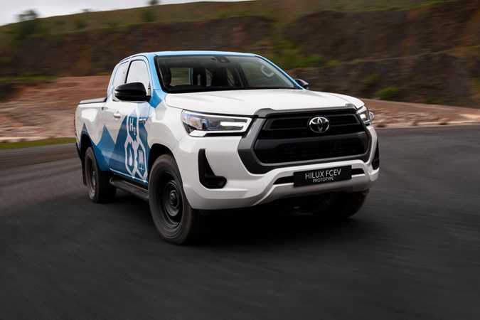 The hydrogen tanks are tucked below the Hilux's cabin.