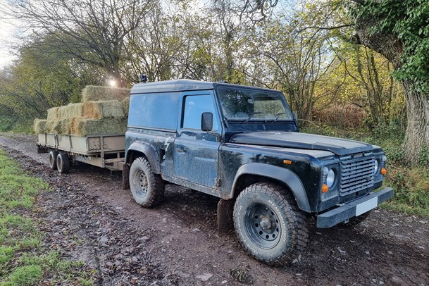 Land Rover Defender towing hay trailer - UK towing laws