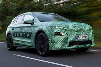 Skoda Elroq prototype review: front three quarter driving, green camo wrap