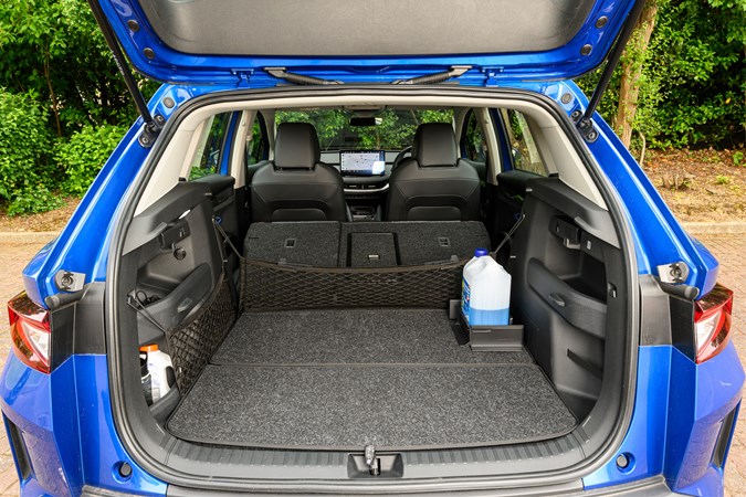 Skoda Elroq boot open, rear seats down, blue paint, black interior