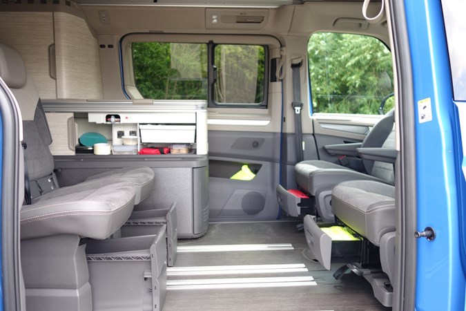 Image of the Volkswagen California rear passenger space, viewed through the open right-side door
