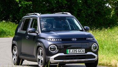 Hyundai Inster review, black, exterior, moving, front three quarters | Parkers