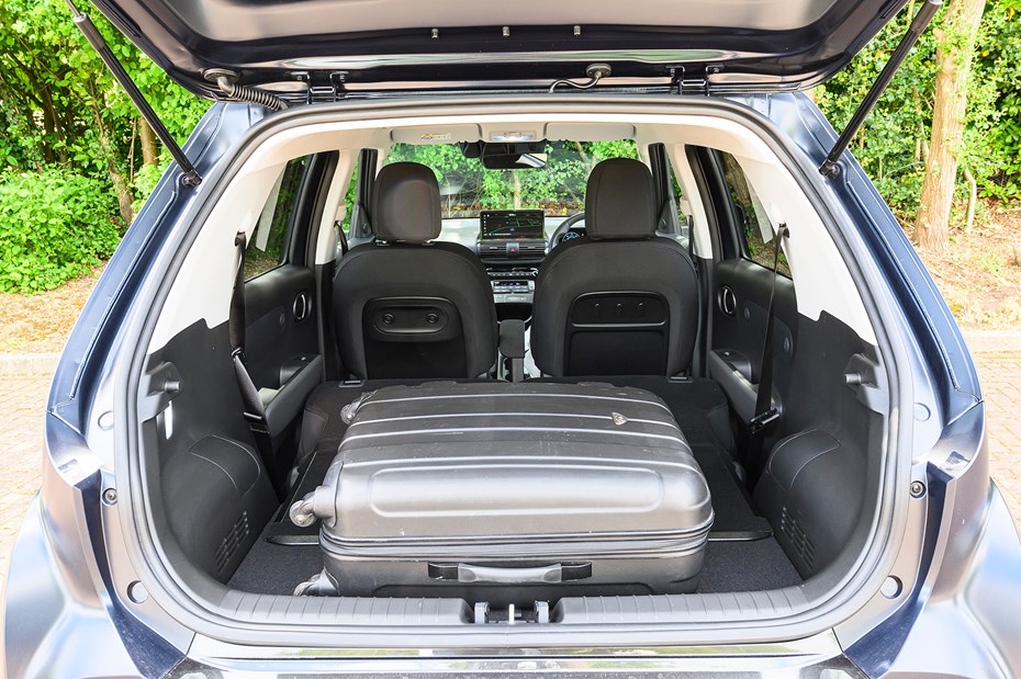 Hyundai Inster review, black, boot capacity, seats down, suitcase | Parkers