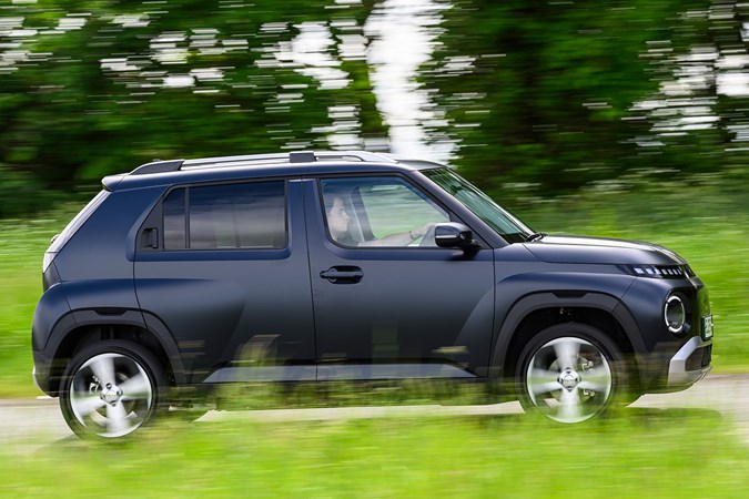 Hyundai Inster review, black, exterior, moving, side profile | Parkers