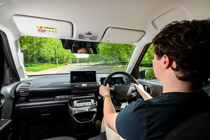 Hyundai Inster review, black interior, Ryan Gilmore driving | Parkers