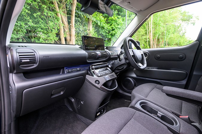 Hyundai Inster review, black, interior, seats, dashboard, steering wheel | Parkers
