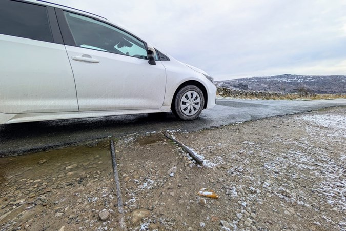 Image of Toyota Corolla Commercial parked next to ancient rail tracks