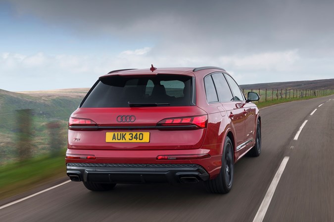 Audi Q7 (2025) review: rear three quarter driving, red paint