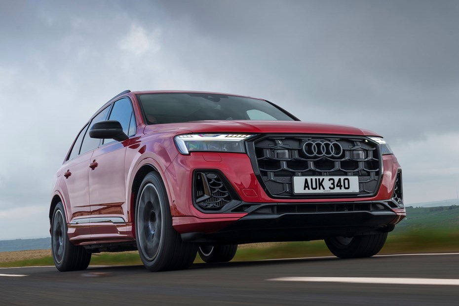 Audi Q7 (2025) review: front three quarter driving, red paint, low angle