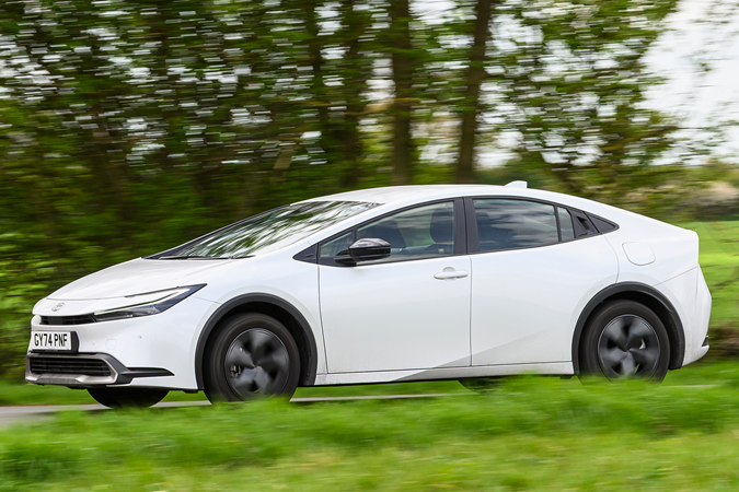 Toyota Prius Long Term test, white, exterior, moving, front three-quarters | Parkers
