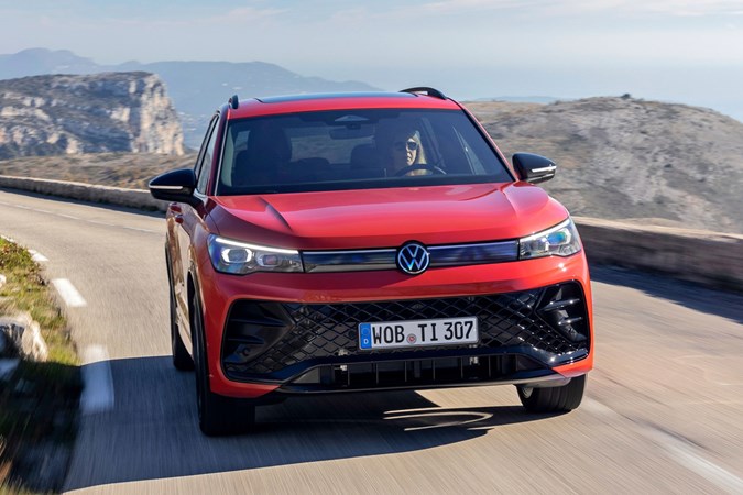 Volkswagen Tiguan eHybrid review - front, orange, driving round corner
