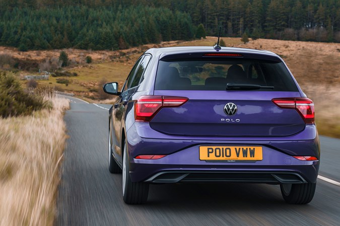 Volkswagen Polo (2024) review: front driving, British road, close up, purple paint