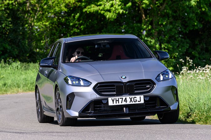 BMW M135 long-term test: front three quarter driving, matte grey paint