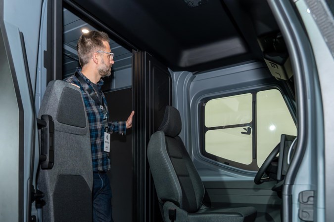 You can walk from the cabin to the rear of the Estafette.