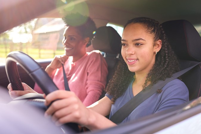 Image of a female driving student demonstrating the correct driving position