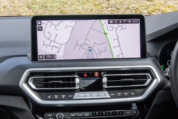 BMW X3 review (2023): infotainment screen, black upholstery