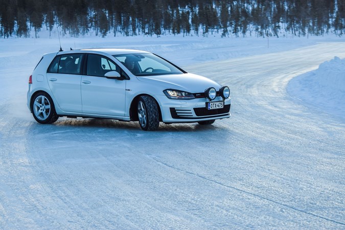 Image of a Volkswagen Golf sliding around a snowy corner